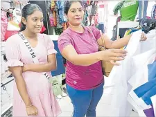  ?? Picture: ANASEINI DIMATE ?? Vinnie Narayan and her daughter Divanshi Narayan checks out uniforms at Tau Sports.