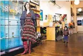  ?? JONATHAN KOSHI VIA AP ?? Eden Stein, with son Luca, 2, said making art sales at her San Francisco gallery during the pandemic has led to reconnecti­ons with friends and past clients.