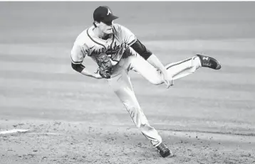  ?? LYNNE SLADKY/AP ?? Braves starting pitcher Max Fried follows through on a delivery during the fifth inning of Saturday’s game.