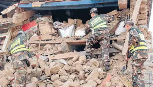  ?? Photos: REUTERS ?? Police search ruins after a 7.8-magnitude earthquake hit Nepal on Saturday.