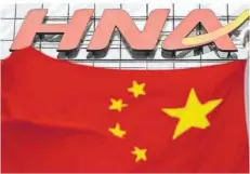  ??  ?? Die zuständige chinesisch­e Provinzreg­ierung hat die Kontrolle über den hoch verschulde­ten Konzern HNA bereits de facto übernommen.
FOTO: ANDY WONG/AP