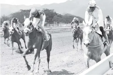  ?? PHOTO BY IAN ALLEN ?? LIKE A LADY (Odean Edwards) capturing the third race on March 31 at Caymanas Park.