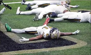  ?? Butch Dill / Associated Press ?? Saints running back Alvin Kamara celebrates his sixth touchdown of the game, tying the NFL record for most rushing touchdowns in a game, in the second half against the Minnesota Vikings in New Orleans on Friday.