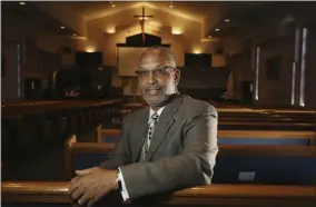  ?? ROSS D. FRANKLIN — THE ASSOCIATED PRESS ?? Civil Rights leader Rev. Dr. Warren H. Stewart Sr. sits in the sanctuary of his church, the First Institutio­nal Baptist Church, in Phoenix. Phoenix’s past segregatio­n has been in focus after this summer’s national outrage over a videotaped encounter of police pointing guns and cursing at a black family. “That has long been a reality for African Americans, to not be treated fairly by the police,” said Stewart. “Segregatio­n has been outlawed, but the remnants of systemic racism and discrimina­tion remain.”