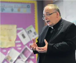  ??  ?? Tribute Current bishop of Dunkeld Stephen Robson seen here speaking to pupils at St John’s RC Academy on Perth