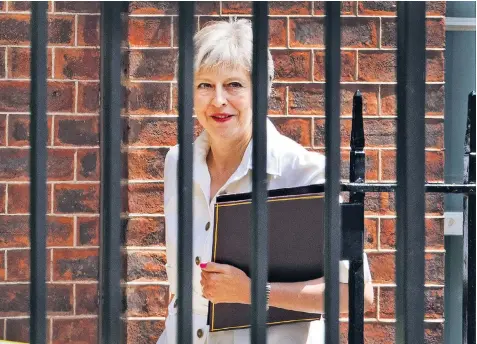  ??  ?? Theresa May leaves Downing Street for Parliament, where she avoided a narrow defeat on Brexit – but she could yet face a vote of no confidence