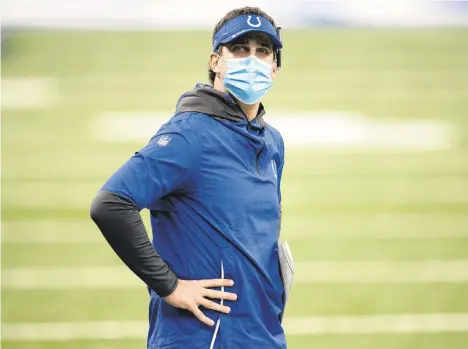  ?? BOLINGER/AP FILE PHOTO ZACH ?? Colts offensive coordinato­r Nick Sirianni watches players warm up on the field before a Nov. 29 game against the Titans in Indianapol­is.