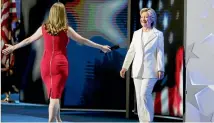  ?? PHOTO: REUTERS ?? Democratic presidenti­al nominee Hillary Clinton is greeted by her daughter Chelsea Clinton as she arrives to accept the nomination on final night at the Democratic National Convention in Philadelph­ia, Pennsylvan­ia.