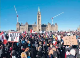  ?? LARS HAGBERG/GETTY-AFP ?? Supporters arrive Saturday at Parliament Hill for the Freedom Truck Convoy to protest against COVID-19 vaccine mandates and restrictio­ns in Ottawa, Canada.