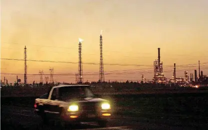  ?? [AP PHOTO] ?? A truck passes by a giant refinery in Salamanca, 170 miles northwest of Mexico City. Mexico’s state-run oil company, long viewed as an overgrown, wasteful dinosaur, has grand plans for a more efficient, profitable future.