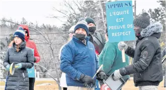  ?? TINA COMEAU ?? Pots and pans, spoons, spatulas and potato mashers, were used to make noise outside of Université Sainte-Anne in Church Point, Digby County, on March 9, where a strike got underway on March 3 by professors and librarians.