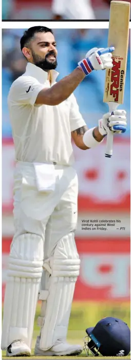  ?? — PTI ?? Virat Kohli celebrates his century against West Indies on Friday.