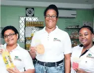  ??  ?? The ladies of The Coconut Shop are ready to serve their customers with a smile. From left are Molesta Baldeo-Gordon, Marjorie Evans-McNish, and Rosemarie Johnson.