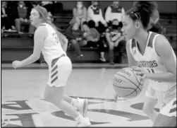  ?? Photo by Gerren Smith ?? LEADING THE WAY: Ouachita’s Lizzy Rowton (10) leads the fast-break in transition with teammate Emma Williams (23) pacing up-court during recent senior high girls basketball action.