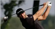  ?? AP PHOTO BY MARK LENNIHAN ?? Dustin Johnson tees off on the 13th hole in the Northern Trust tournament at Liberty National Golf Course, Thursday, Aug. 8, 2019, in Jersey City, N.J.