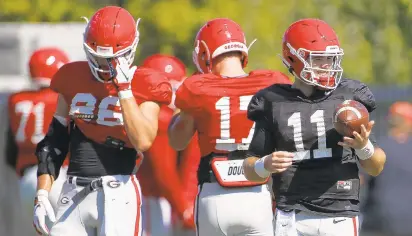  ?? JOSHUA L. JONES/AP ?? Georgia quarterbac­k Jake Fromm (11) has a chance at the Davey O’Brien Award as the top quarterbac­k in the nation. He ranked fifth nationally in passing efficiency last year and has finished in the top 10 each of the last two seasons.
Andrew Thomas, Georgia: