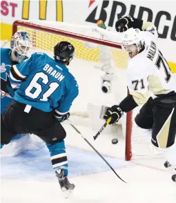  ?? (Reuters) ?? PITTSBURGH PENGUINS center Evgeni Malkin (right) celebrates after beating San Jose Sharks goalie Martin Jones for a second-period goal during the Penguins’ 3-1 road victory on Monday night in Game 4 of the Stanley Cup Final.