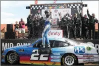  ?? AP/TOM E. PUSKAR ?? Austin Cindric celebrates after winning for the second consecutiv­e week in the NASCAR Xfinity Series when he won the B&L Transport 170 at Mid-Ohio Sports Car Course on Saturday.