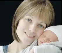  ??  JULIE OLIVER/OTTAWA CITIZEN ?? Jillian O’Connor, with her newborn son, Declan is receiving aggressive treatment for her Stage 4 breast cancer.