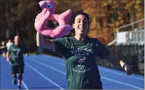  ?? Erik Trautmann / Hearst Connecticu­t Media ?? Bunnell High School faculty and their familes including Madeline Tatto run in the mini Vicki Soto 5K Saturday.