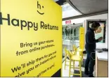  ?? AP PHOTO DAMIAN DOVARGANES ?? Happy Returns "return-ista" Taj Sims processes a customer's return at the company's kiosk designed to make it easier for buyers of online merchandis­e to be returned, at the Santa Monica Place mall in Santa Monica, Calif. As online shopping surges, so...