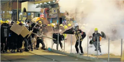  ?? Photo / AP ?? Protests in Hong Kong on Sunday turned violent as riot police and protesters clashed.