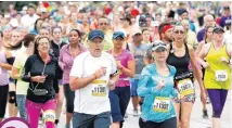  ?? [PHOTO BY NATE BILLINGS, THE OKLAHOMAN ARCHIVES] ?? Runners leave the state Capitol complex as they run north on Lincoln Boulevard during the 15th annual Oklahoma City Memorial Marathon last year.