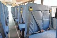  ?? AARON E. MARTINEZ/AMERICAN-STATESMAN ?? A Hays CISD school bus equipped with 3-point lap and shoulder seat belts is displayed outside a Hays Consolidat­ed Independen­t School District Board of Trustees meeting at the historic Buda Elementary campus on Monday.