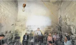  ?? PICTURE: DAVID RITCHIE ?? HISTORY LESSON: Chief executive of the Castle Control Board Calvyn Gilfellan, in a torture room at the Castle, addresses the media at a Castle and minstrels media briefing about the role of slaves in Cape Town and at the Castle.