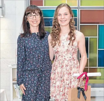  ??  ?? Winning writer: Amelia Kendall, right, pictured with judge Emily Perkins, won the secondary school division at the
Short Story Awards.