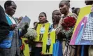  ?? Photograph: James Wakibia/Sopa Images/Rex/Shuttersto­ck ?? Mourners hold portraits of their loved ones during a prayer and mass funeral service for those who died in the Mai Mahiu floods.