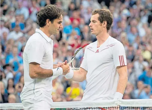  ??  ?? HAND OF FRIENDSHIP: Roger Federer being congratula­ted by Andy Murray at Wimbledon 2012; the Swiss ace has paid tribute to the Scot