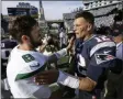  ?? STEVEN SENNE - THE ASSOCIATED PRESS ?? New York Jets quarterbac­k Luke Falk, left, and New England Patriots quarterbac­k Tom Brady speak at midfield after an NFL football game, Sunday, Sept. 22, 2019, in Foxborough, Mass.