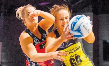  ?? Photo / Photosport ?? Kelly Jury, of the Central Pulse, tussles with Ellie Bird (Tactix) in yesterday’s match.