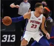  ?? CARLOS OSORIO — THE ASSOCIATED PRESS ?? Detroit Pistons forward Blake Griffin is defended by New York Knicks forward Julius Randle during the first half of a Dec. 11 preseason game in Detroit.