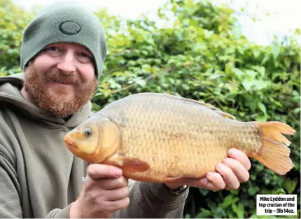  ??  ?? Mike Lyddon and top crucian of the trip – 3lb 14oz.