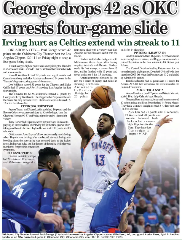  ?? ASSOCIATED PRESS ?? Oklahoma City Thunder forward Paul George (13) shoots between Los Angeles Clippers center Willie Reed, left, and guard Austin Rivers, right, in the third quarter of an NBA basketball game in Oklahoma City. Oklahoma City won 120-111.