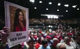  ?? MIKE STEWART/ ASSOCIATED PRESS ?? A supporter holds a sign with a photo of Laken Riley before Republican presidenti­al candidate Donald Trump speaks at a campaign rally March 9 in Rome, Ga.