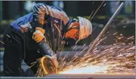  ?? LUO JISHENG / FOR CHINA DAILY ?? An employee performs grinding operations at a Magang facility in Maanshan, Anhui province, on March 5.