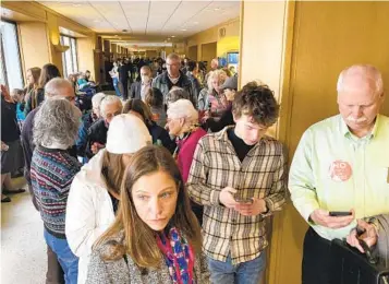  ?? ANDREW SELSKY AP ?? People line up in March outside a hearing room at Oregon’s state Capitol in Salem, where a public hearing was being held on a bill seeking to expand access to abortion and gender-affirming care.