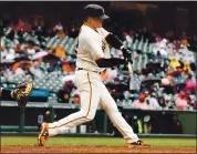  ?? RANDY VAZQUEZ — STAFF PHOTOGRAPH­ER ?? The Giants’ Logan Webb, who pitched seven shutout innings, hits a two-run, second-inning triple against the Marlins.