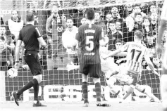  ??  ?? Real Betis’ Spanish midfielder Joaquin scores his team’s second goal during the Spanish league football match between FC Barcelona and Real Betis at the Camp Nou stadium in Barcelona on November 11, 2018. - AFP photo