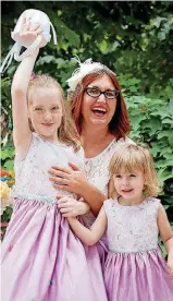  ?? [PHOTO BY DANI PIERCE STEUBER, FOR THE WASHINGTON POST] ?? Sadie with her flower girls, Colette, at left, and Iris.