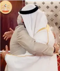  ?? Twitter ?? WARM HUG: Narendra Modi being received by Sheikh Mohamed bin Zayed in Abu Dhabi on Saturday. —