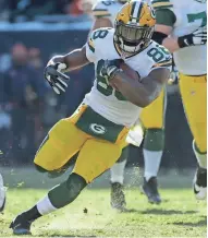  ?? MARK HOFFMAN / MILWAUKEE JOURNAL SENTINEL ?? Packers running back Ty Montgomery finds a seam for 36 of his 162 yards on the ground Sunday afternoon at Soldier Field.