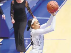  ?? RYAN MURRAY ?? Aryna Taylor of Mount St. Mary’s shoots a 3-pointer during a game last season.