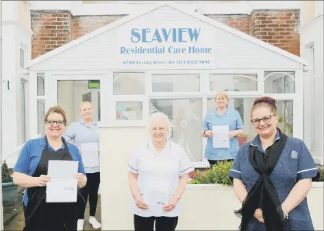  ??  ?? FROM LEFT Ella Toms, chef, Sarah Harris, domestic, Margaret Young, deputy manager, Jackie Compton, senior carer, with Kacee