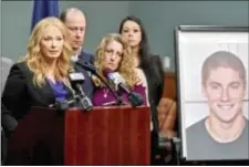  ?? ABBY DREY/CENTRE DAILY TIMES VIA AP, FILE ?? In this May 5 file photo, Centre County, Pa., District Attorney Stacy Parks Miller, left, announces findings an investigat­ion into the death of Penn State University fraternity pledge Tim Piazza, seen in photo at right, as his parents, Jim and Evelyn...