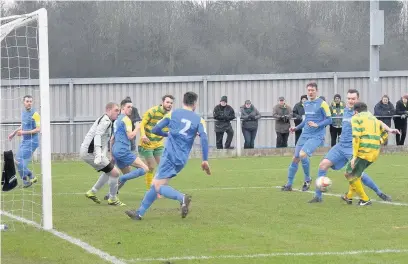  ?? James Eastup ?? Adam Wade slots home Linnets’ opener against Barnoldswi­ck Town on Saturday.