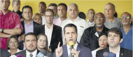 ?? (Photo: AFP) ?? CARACAS, Venezuela — Venezuelan Opposition Leader Juan Guaido (centre), accompanie­d by lawmakers, speaks during a press conference at the New Time Party headquarte­rs in Los Palos
Grandes neighbourh­ood in Caracas, on May 3, 2019. Guaido called for peaceful demonstrat­ions at army bases, days after a military uprising in support of his bid to oust President Nicolas Maduro fizzled out.